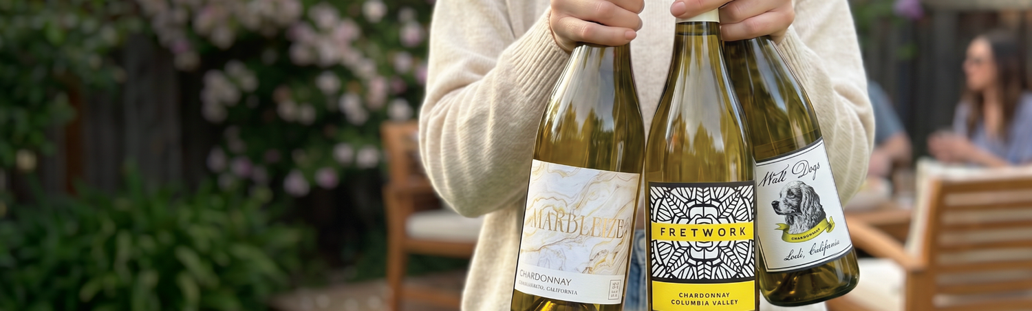 person holding chardonnay wines