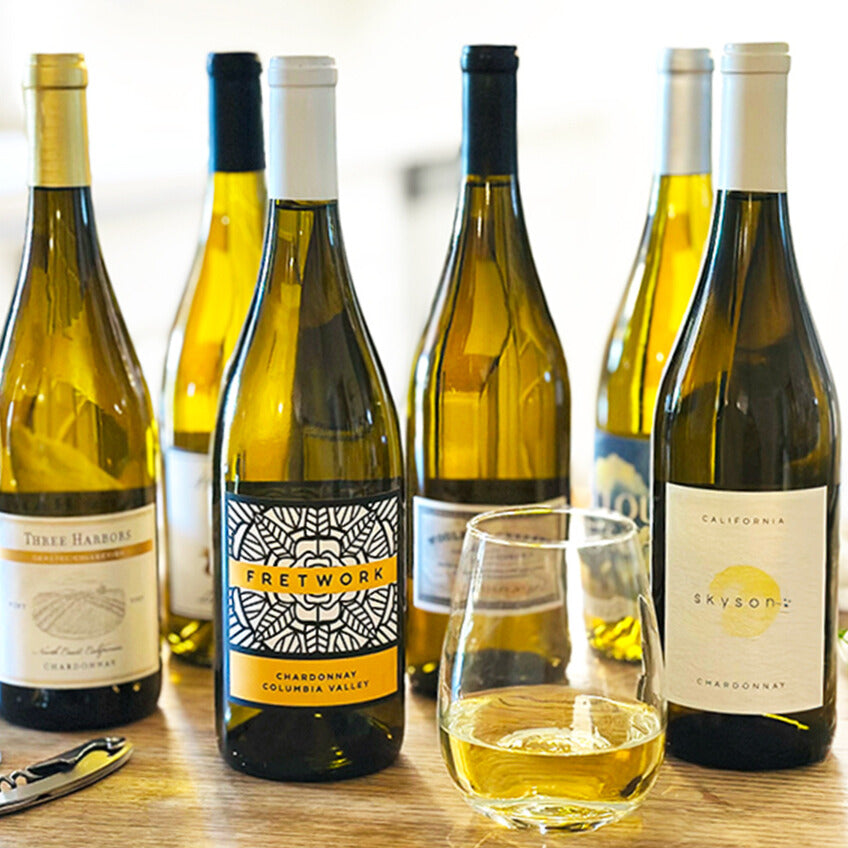 chardonnay wines with glass and wine opener on table